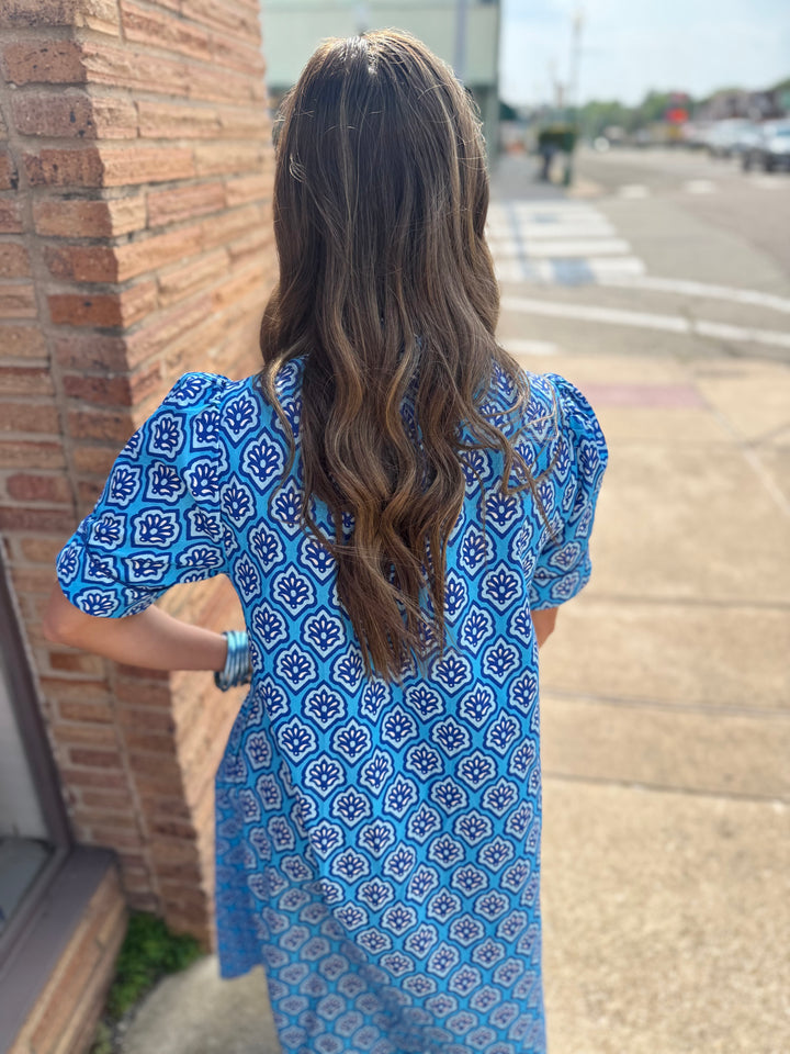 Bright Blue Printed Button Down Midi Dress with all-over print, buttons down front. Available in sizes XS-XL.