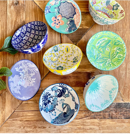 Seven Classic Collection Tidbit Bowls with vibrant floral and bird motifs in blue, green, yellow, orange. Sizes: 4", 6", 8".