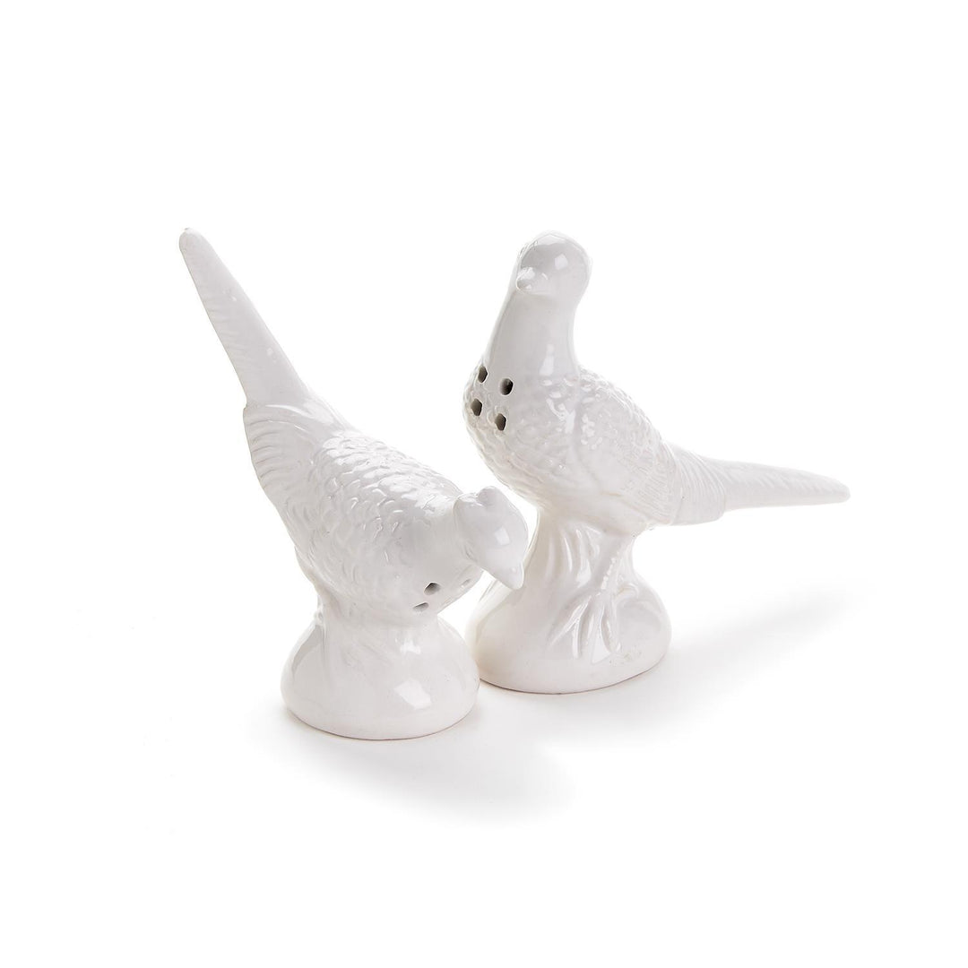 Two white ceramic bird-shaped shakers in a vintage-inspired pheasant design. Available in one standard size.