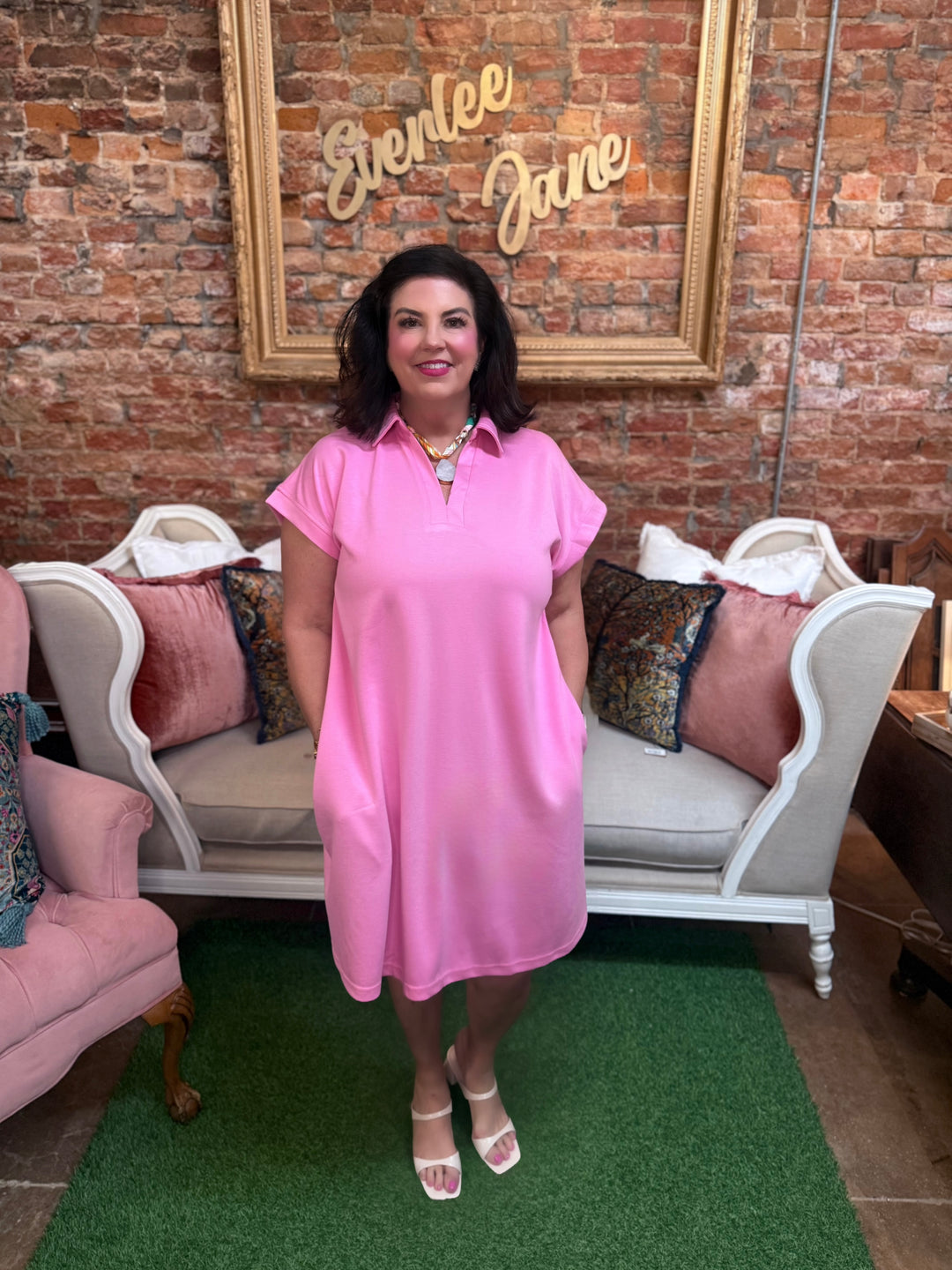 Breathable pink collared mini dress with short sleeves and side pockets. Available in various sizes.