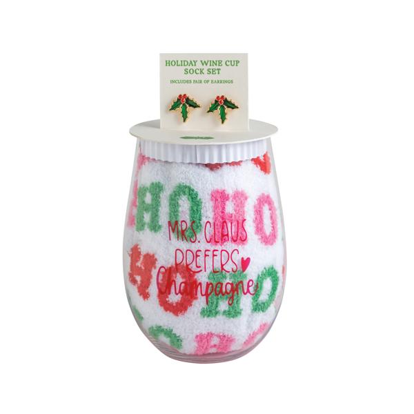 Holiday wine glass, earring, and sock set with clear plastic wine cup, white “Ho Ho Ho” socks, and holly earrings on a display card.