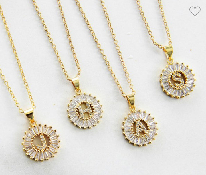 Stainless steel necklaces with CZ initial pendants (D, B, A, S). Available in 16", 18", and 20" lengths.