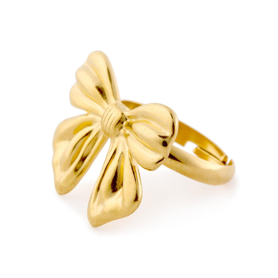 Shiny adjustable gold ring with large sculpted bow design on top; available in multiple sizes.