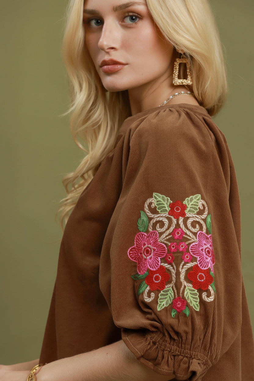 Embroidered Sleeve Corduroy Blouse with colorful floral embroidery on brown balloon sleeves; available in sizes XS–XL.