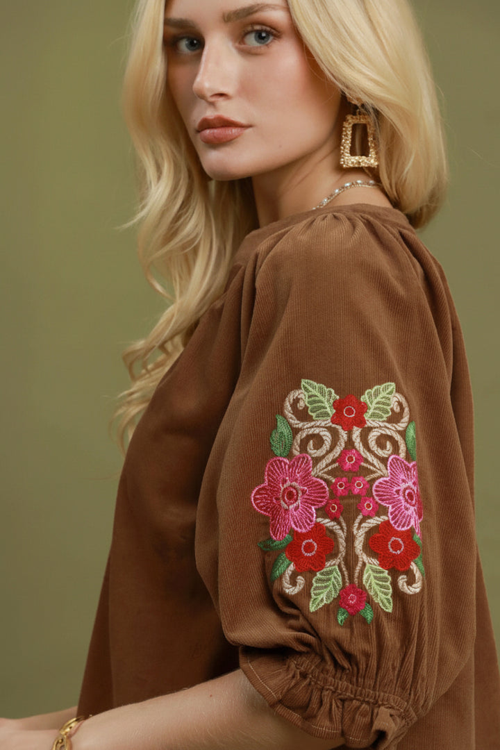 Embroidered Sleeve Corduroy Blouse with colorful floral embroidery on brown balloon sleeves; available in sizes XS–XL.