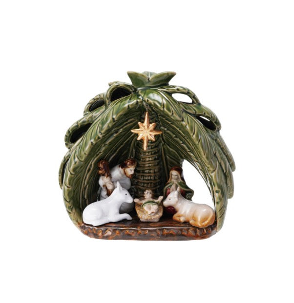 Vintage stoneware Nativity set with Holy Family, two animals, palm-frond arch, and gold star.