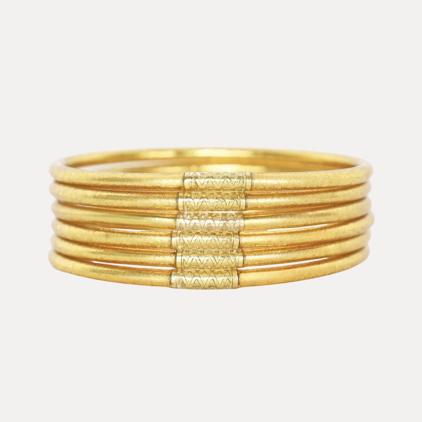 Aura Lumine All Weather Bangles - Large: gold-toned ring formed by five parallel bands with a textured, zigzag-patterned centerpiece. Size available: Large.