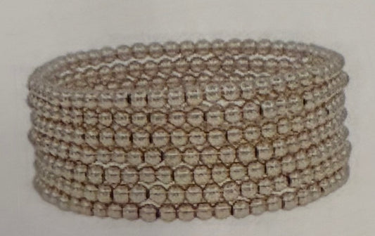Mya Six Strand Stretch Bracelet with small clear or pale beads in a layered design; available in multiple sizes.