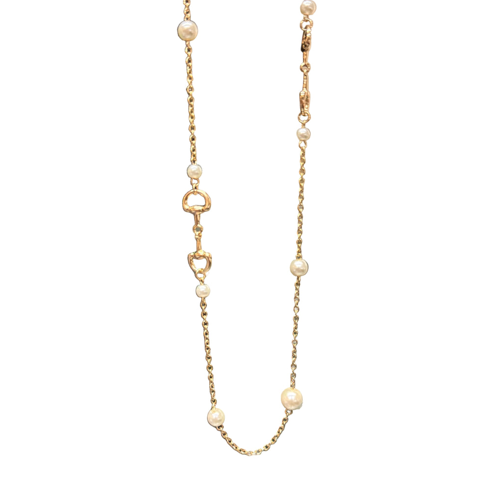 Candy Gold Pearl Necklace with small pearls, gold heart-shaped links, and horse-bit details along the chain. Available in 16" and 18" lengths.