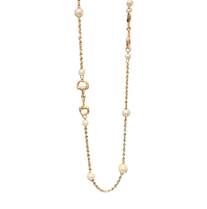 Candy Gold Pearl Necklace with small pearls, gold heart-shaped links, and horse-bit details along the chain. Available in 16" and 18" lengths.