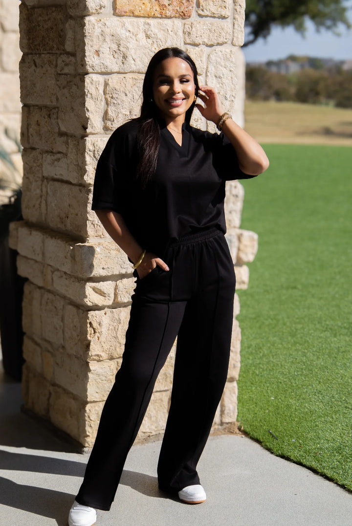 Black Butter Soft Pants with a wide-leg silhouette; available in sizes XS-XL.