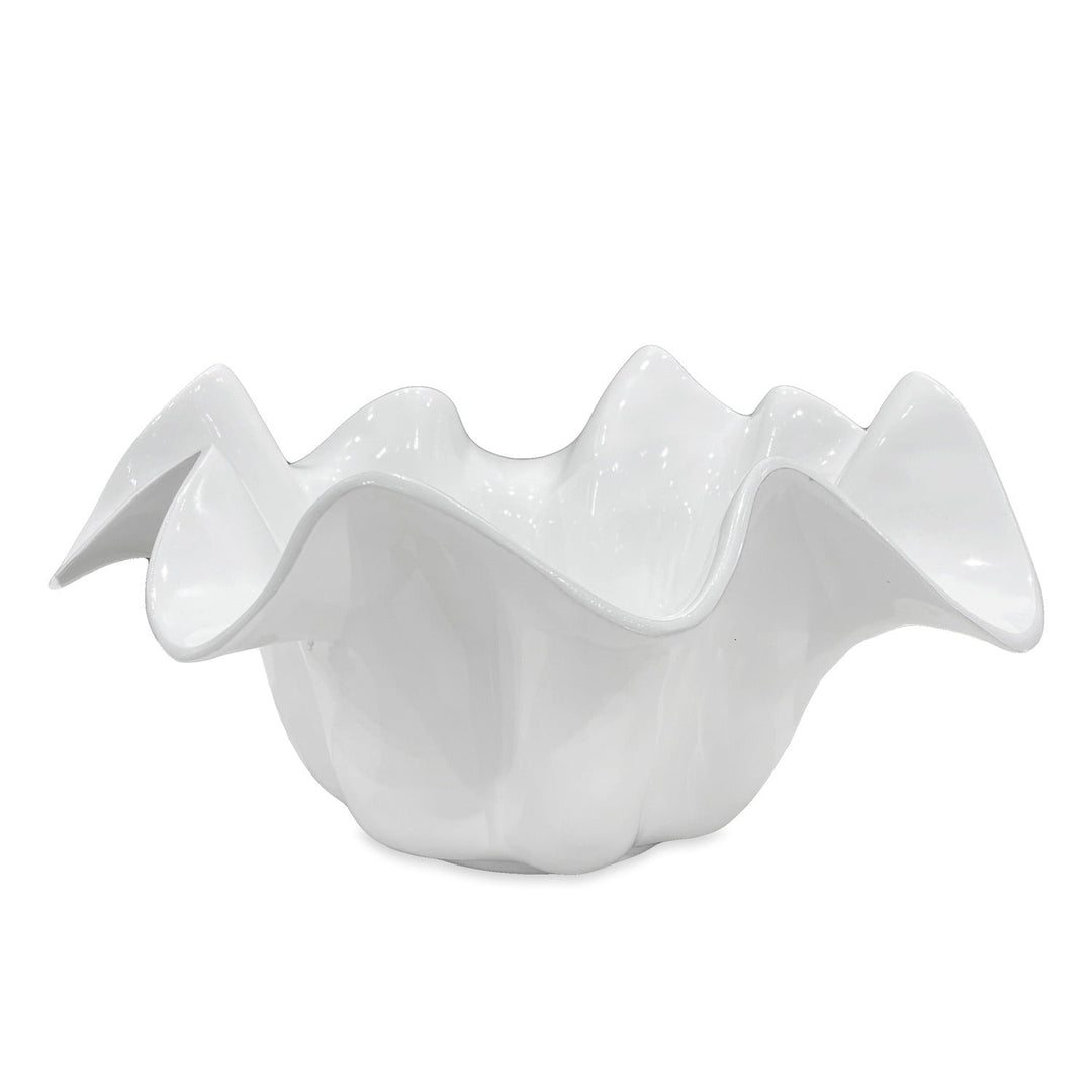 Glossy white ceramic bowl with wavy, ruffled edge; medium size; organic, floral-inspired shape.