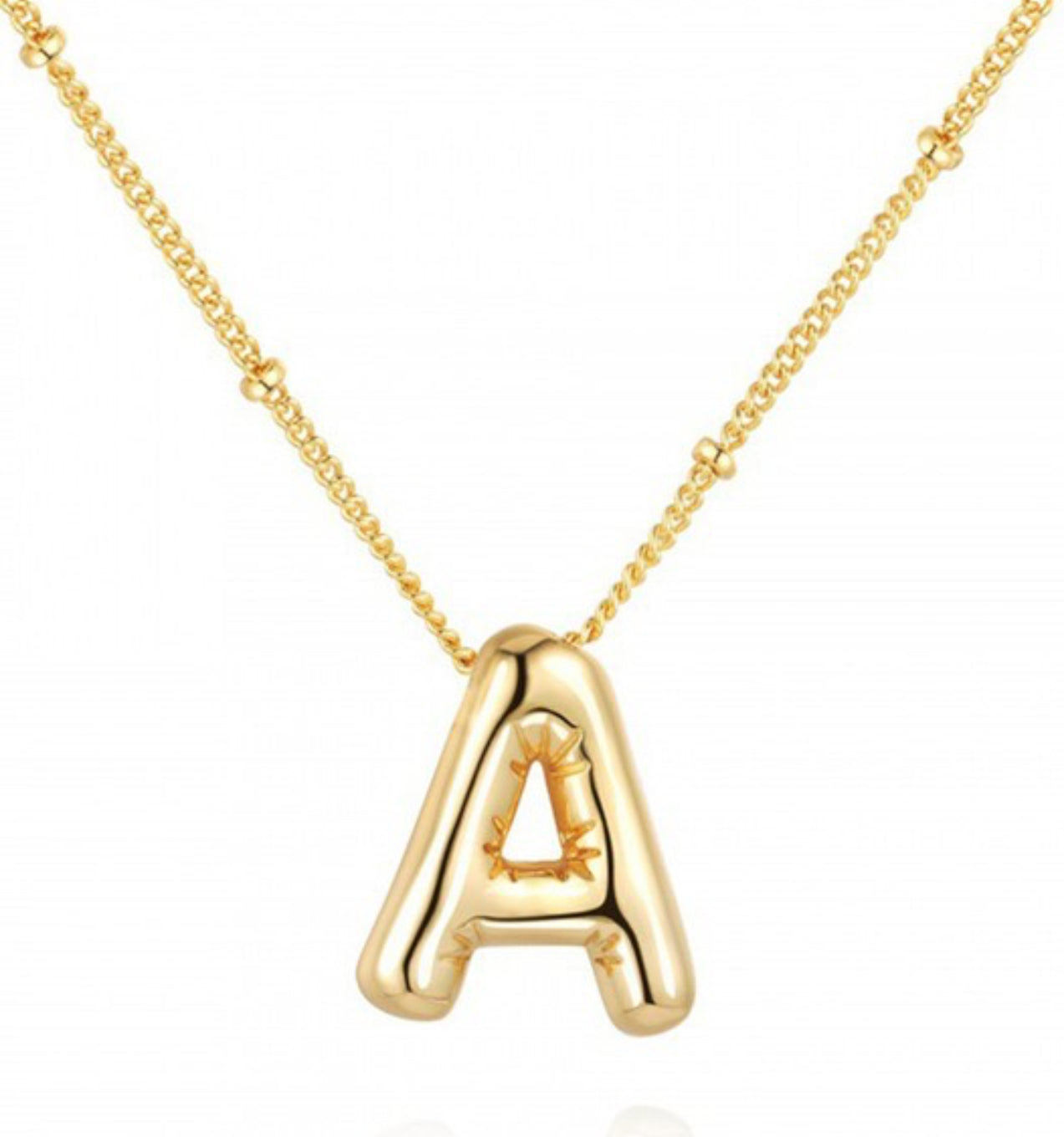 This is a Personalized Bubble Balloon Initial Necklace featuring a delicate pendant in the shape of the lowercase letter 'a'. The pendant is suspended on a dainty, thin chain. All components are crafted with precision and attention to detail. This necklace is available in two sizes: 18 inches and 20 inches.