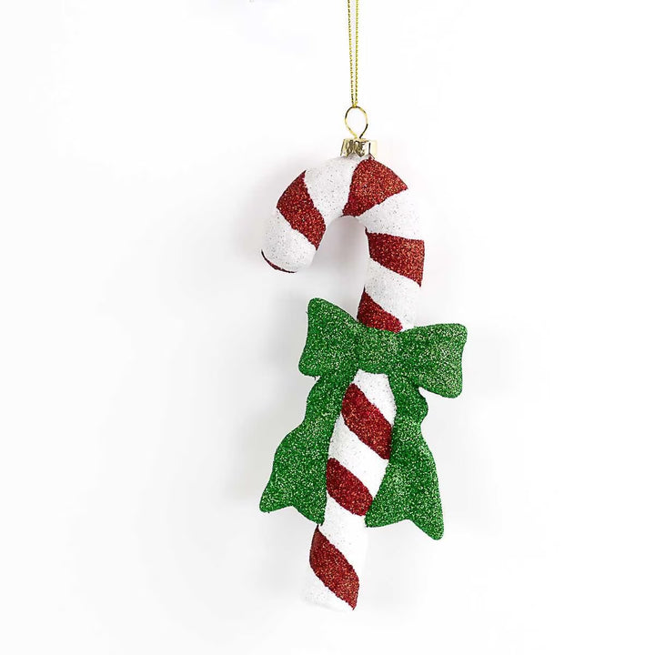 Red and white glittery candy cane ornament with a green glittery bow.