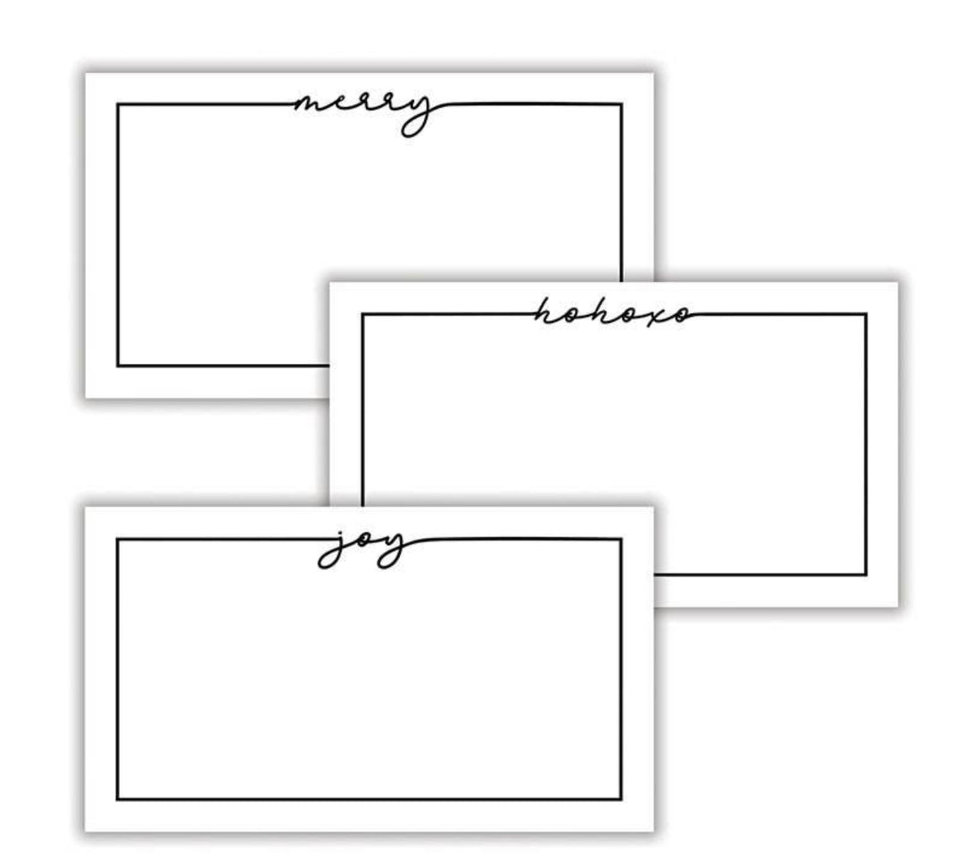 Three white rectangular holiday place cards with a black border and script text merry, hohoho, or joy.