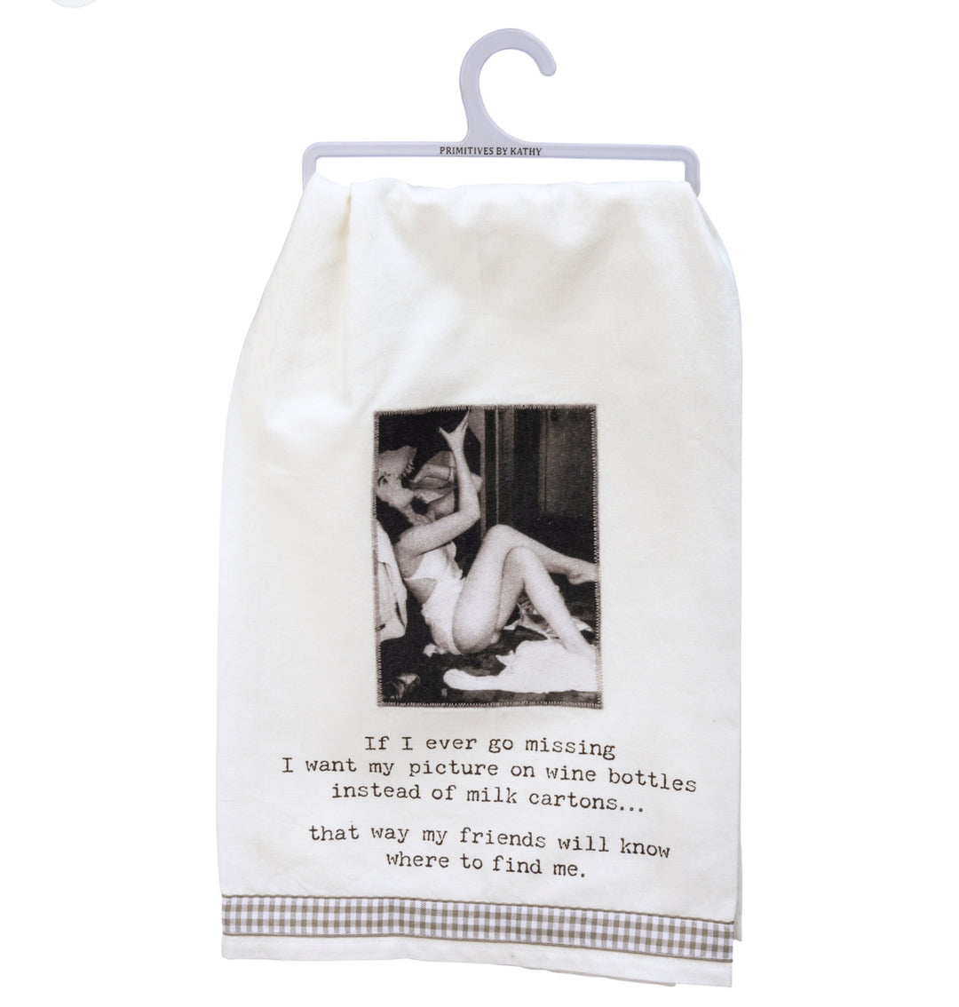 White cotton kitchen towel on plastic hanger with humorous wine saying, available in multiple sizes.