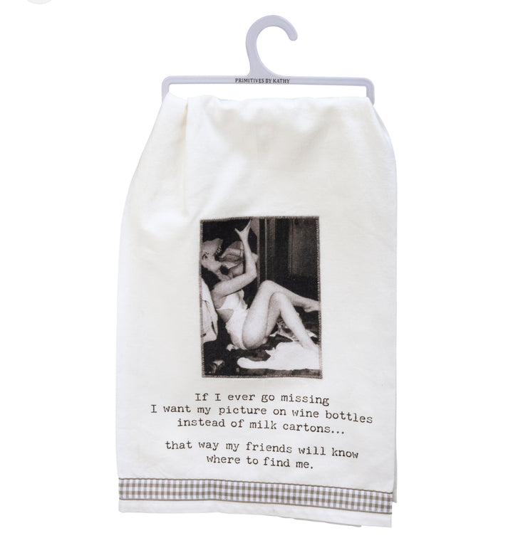 White cotton kitchen towel on plastic hanger with humorous wine saying, available in multiple sizes.