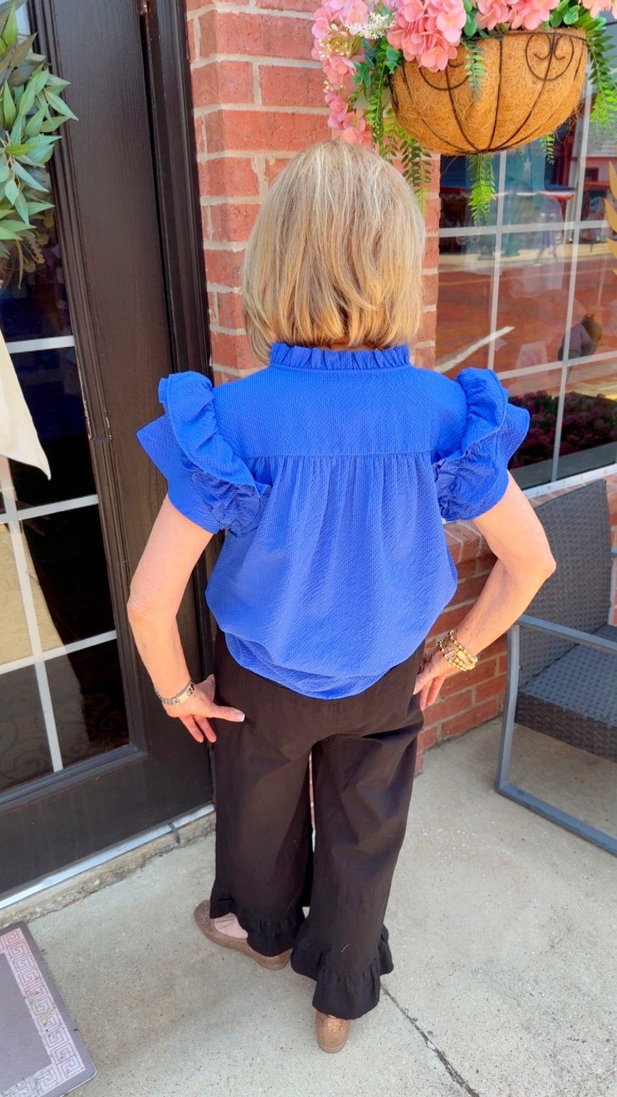 Ocean Breeze Ruffle Sleeve Top in bright blue with ruffle sleeves, available in sizes XS-XL.