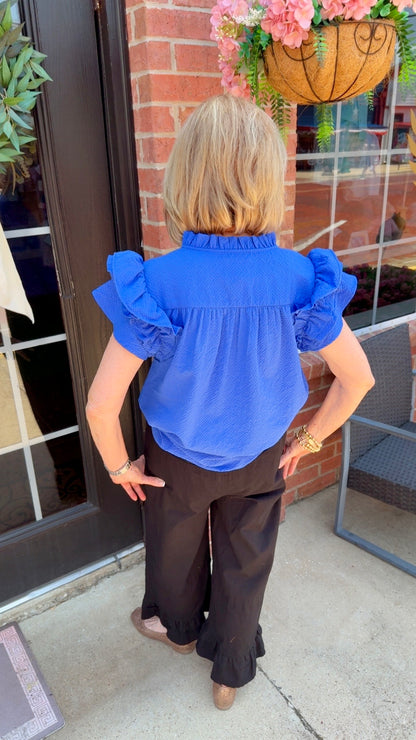Ocean Breeze Ruffle Sleeve Top in bright blue with ruffle sleeves, available in sizes XS-XL.