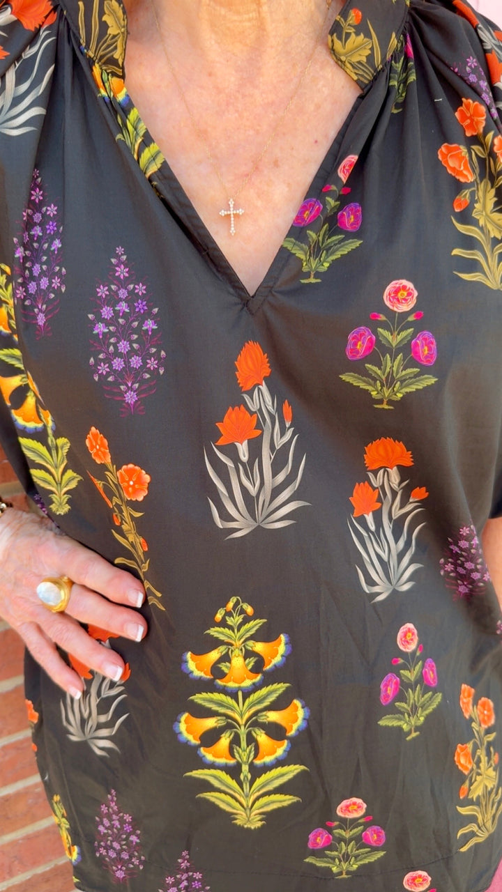 Maisie Floral Scallop Top: black with colorful floral print, scalloped edges. Available in sizes XS–XL.