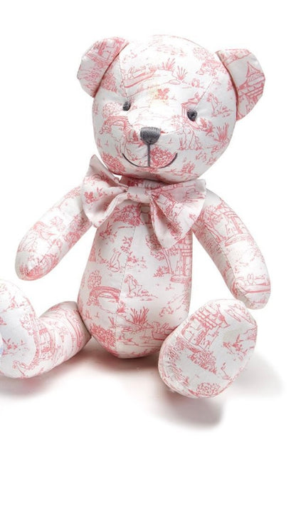 Pink and white scenic toile teddy bear with black button eyes, stitched face, movable limbs, neck bow. Available in 12" and 18".