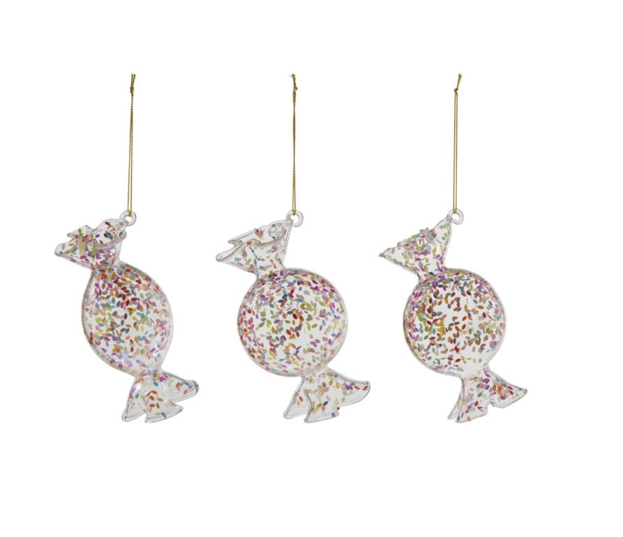 Three Confetti Glass ornaments, clear glass with colorful confetti, on gold strings.