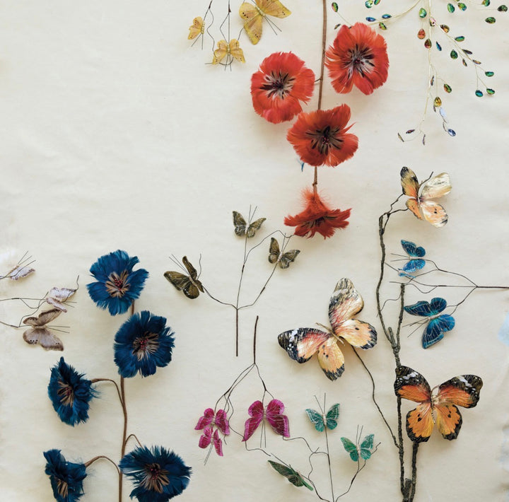 Indigo Feather Floral Stem with blue and red feathered blossoms and wire-winged butterflies.