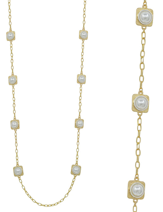 Fama Gold Pearl Necklace with square gold settings and round white pearls evenly spaced on a chain. Shown in full view and close-up. Available in 16-inch, 18-inch, and 20-inch sizes.