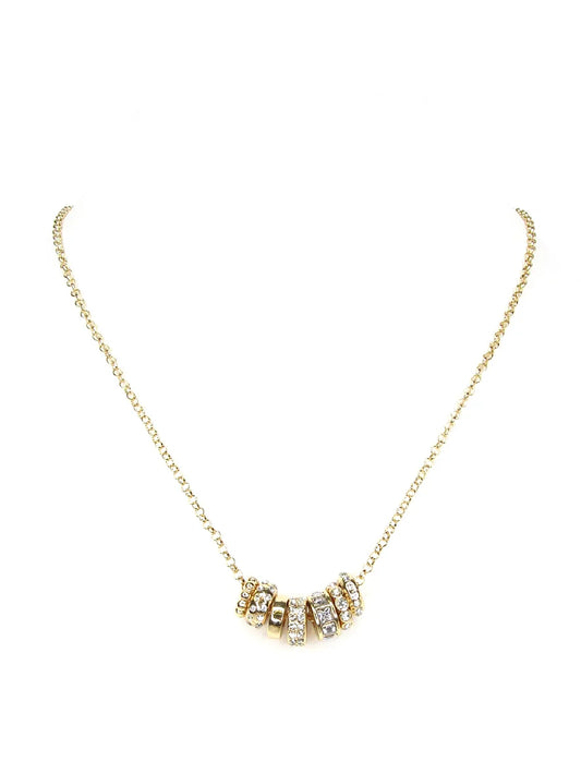 Far Gold Charm Necklace with five gold and rhinestone-studded ring charms at the center; available in 16, 18, and 20-inch lengths.