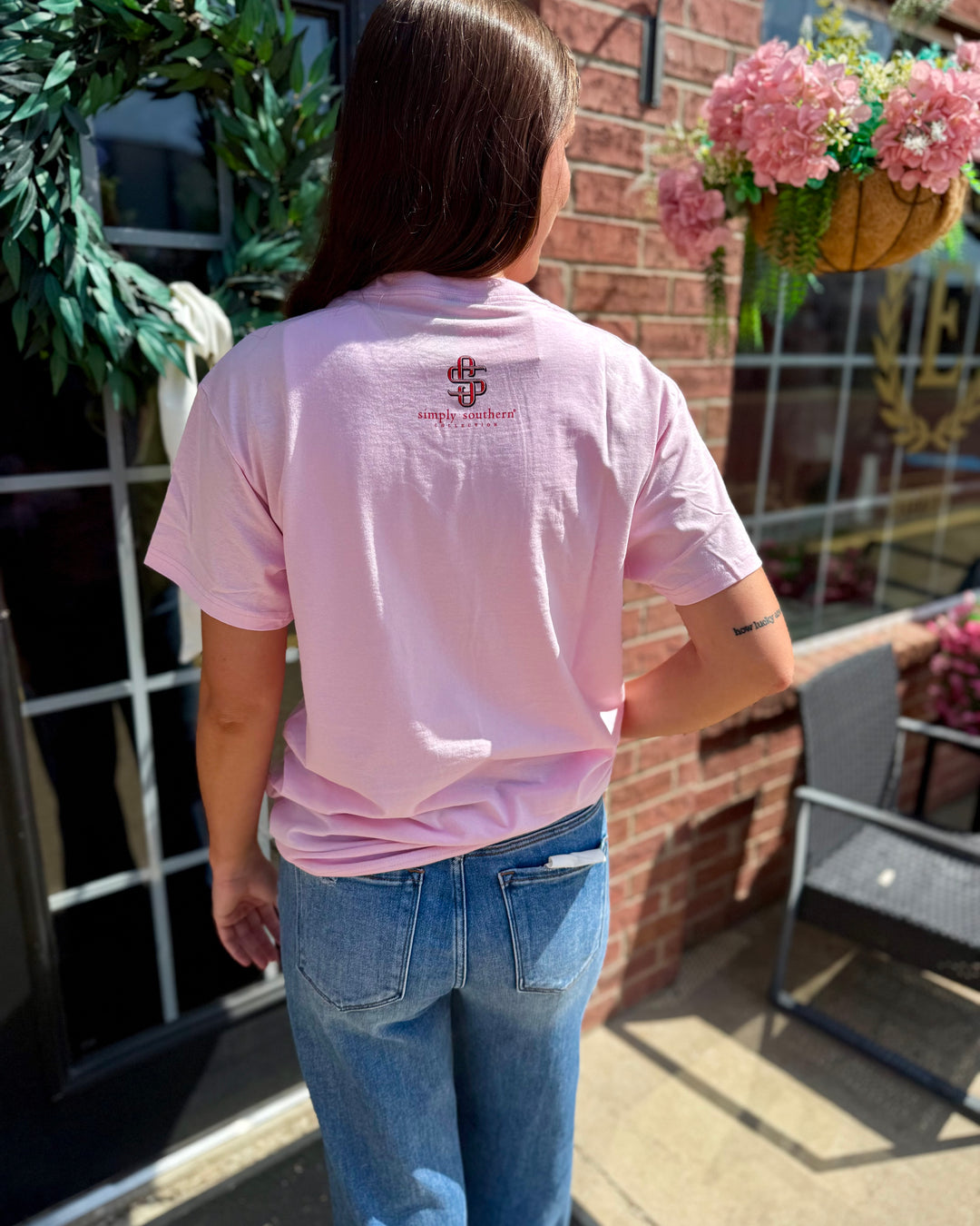 Light pink Y’all Are Nuts Tee with small festive logo on back. Available in sizes S-XXL.
