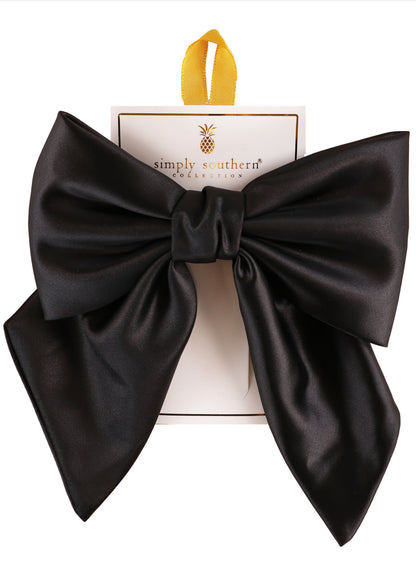Large black satin bow from Simply Southern on branded card, yellow loop; available in large size.