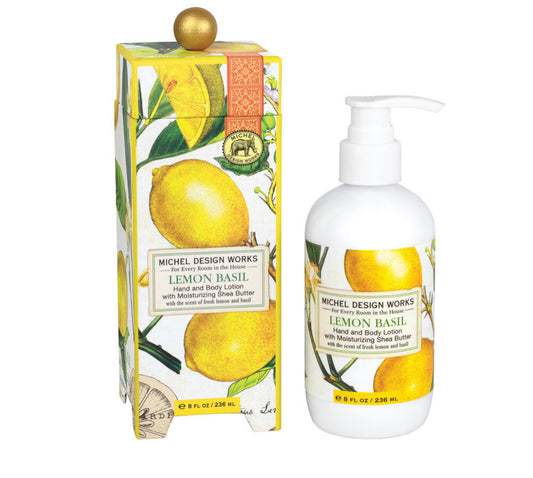 Lemon Basil Lotion by Michel Design Works with pump dispenser. Features illustrations of lemons, basil leaves, and lavender extract on the bottle and box. Available sizes: 8 fl oz (236 ml).