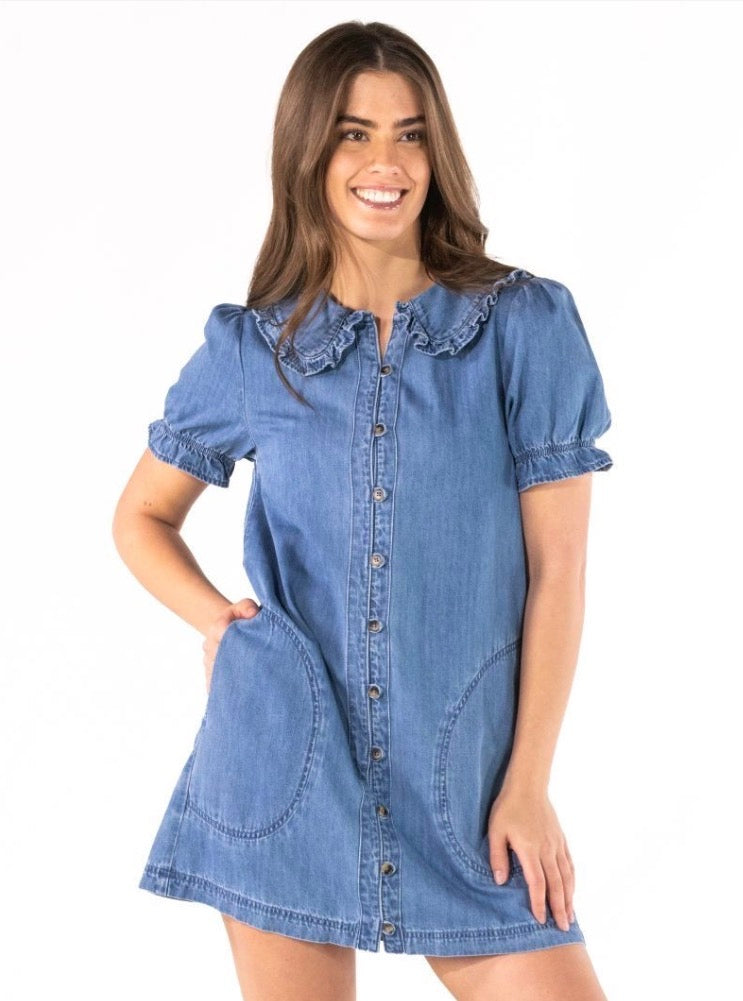 Denim Ruffle Collar Mini Dress with short sleeves, button front, large pockets, and ruffled collar. Available in sizes XS-XL.