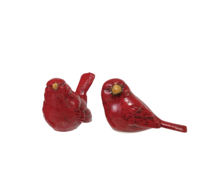 Two red and yellow hand-painted embossed ceramic bird figurines.