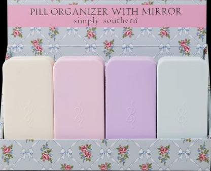 Four Pill Organizer With Mirror available in cream, pink, lavender, and light blue. Sizes available.