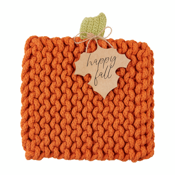 Square orange knit pumpkin trivet with green stem and “happy fall” leaf tag.