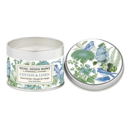 Round Cotton & Linen Travel Candle with botanical and blue bird design, white wax visible. Available in 4oz, 8oz, and 12oz sizes.