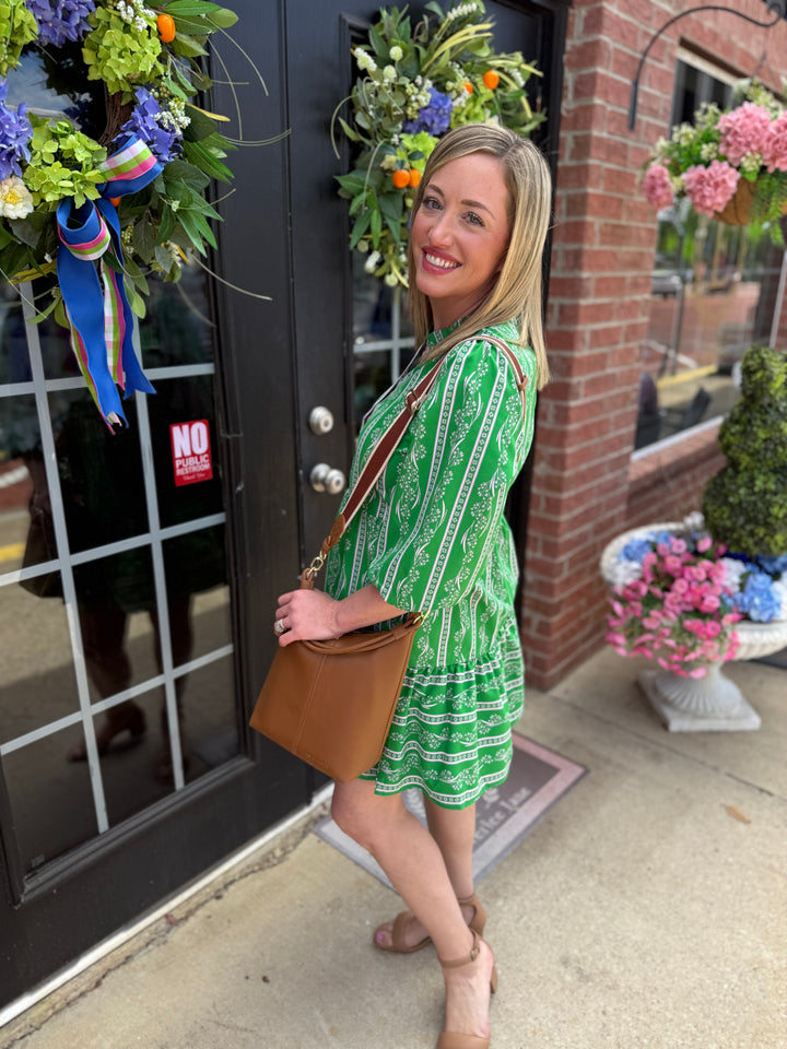 Riley Garden Lace Green Dress with a tiered skirt, available in sizes XS-XL.