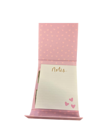 Pink notepad holder with heart design, gold "Notes" label, three pink hearts, includes pen. Sizes available: small, medium.