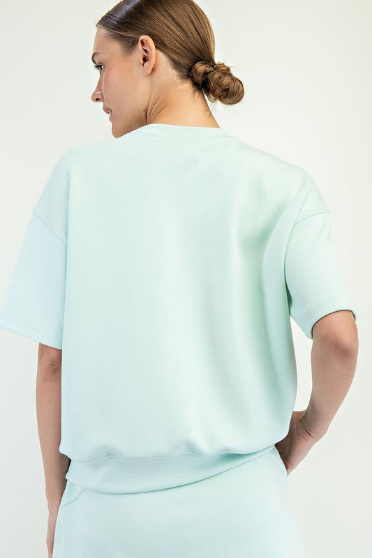 Modal Scuba Top in light blue, available in sizes XS-XL.