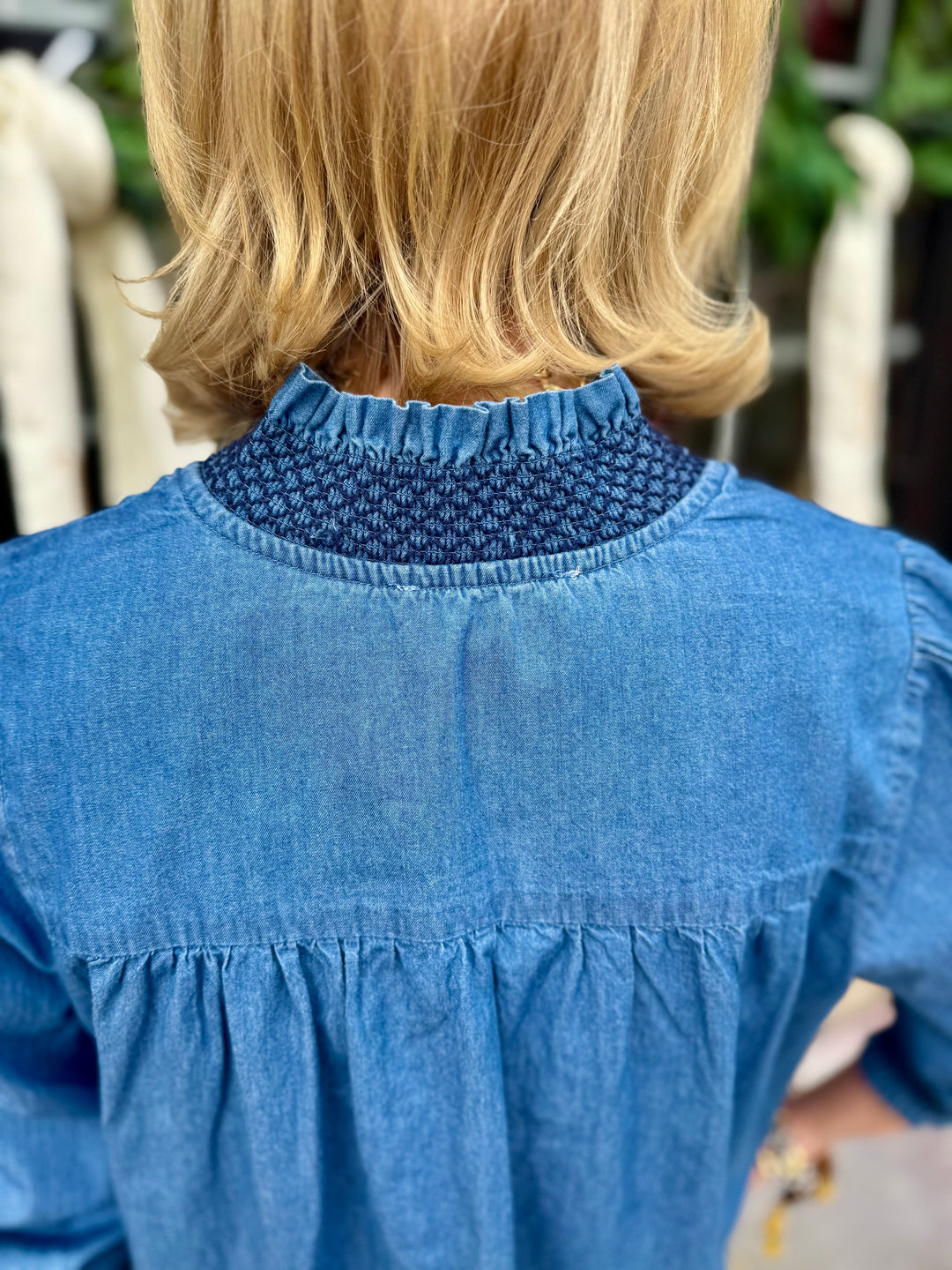 Kimberly Chambray Top with gathered, smocked neckline detail, available in sizes XS–XL.