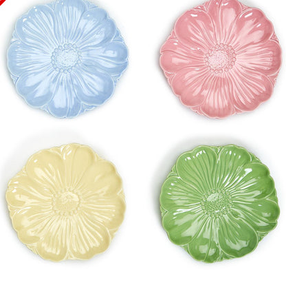 Set of four ceramic flower-shaped plates in blue, pink, yellow, and green. Available in small and medium sizes.