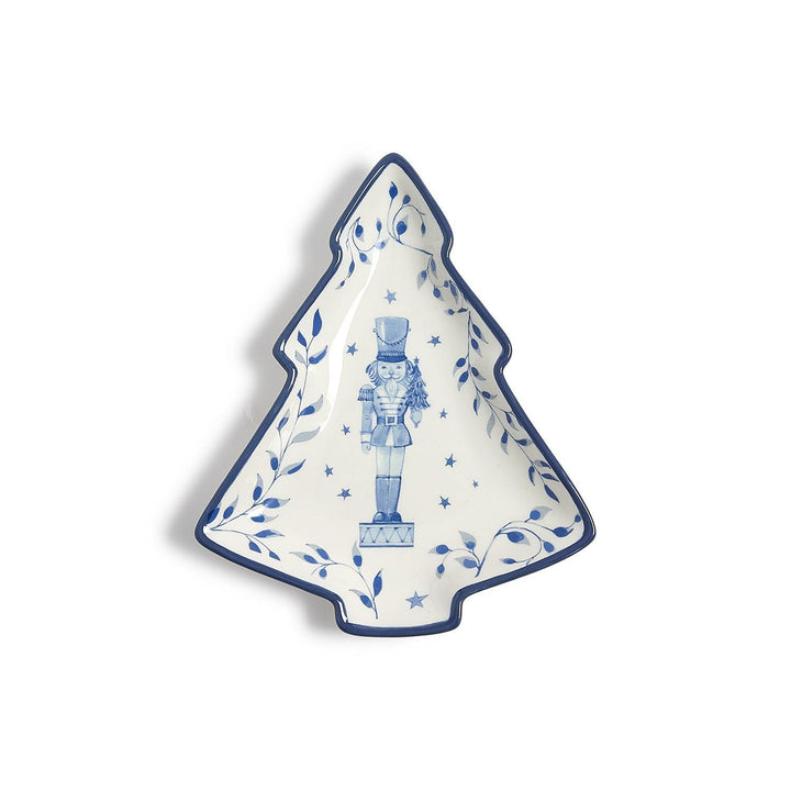 Season’s Gala Christmas tree-shaped tidbit dish with blue and white nutcracker illustration and leaf border.