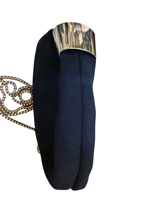 Modern black oval suede clutch with gold clasp and chain strap. Available in small, medium, and large sizes.