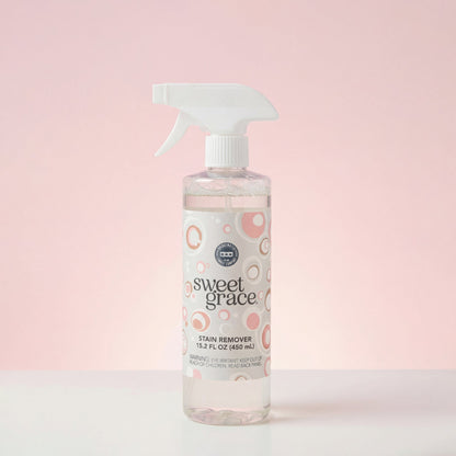 Sweet Grace Stain Remover clear spray bottle with white nozzle; pink/beige label. Available in 16oz and 32oz sizes.