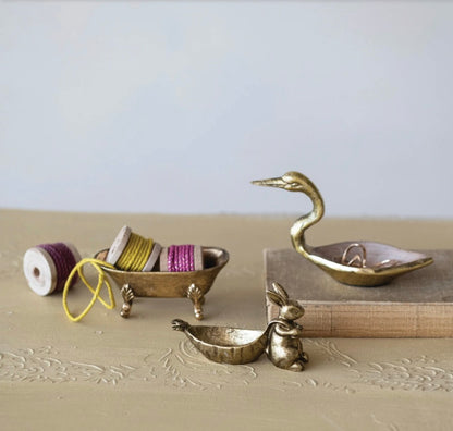 Decorative pewter dish with antique gold rabbit shape finish. Available in small (4"), medium (6"), and large (8") sizes.