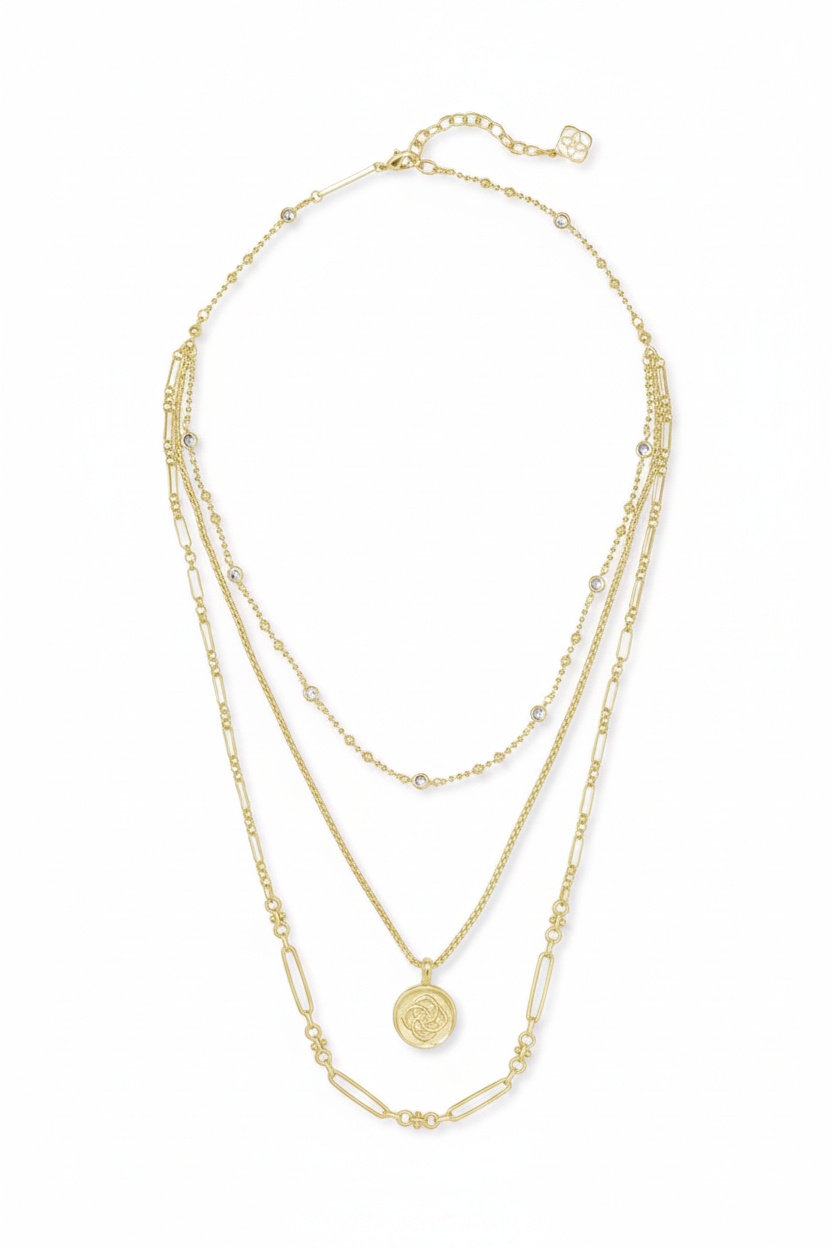 Three-layer 14k gold-plated Kendra Scott necklace with small bead accents, geometric links, round medallion pendant, and adjustable clasp. Available in 16", 18", and 20" lengths.