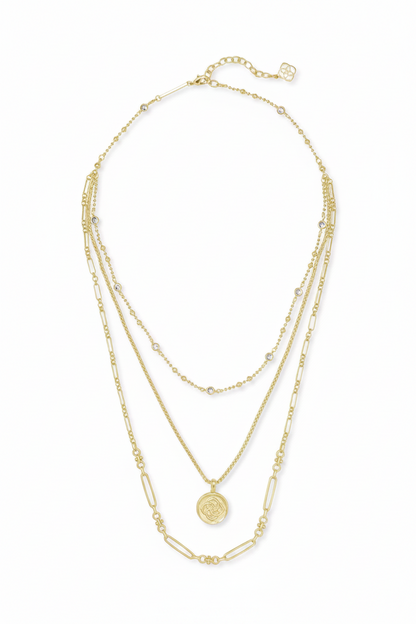 Three-layer 14k gold-plated Kendra Scott necklace with small bead accents, geometric links, round medallion pendant, and adjustable clasp. Available in 16", 18", and 20" lengths.
