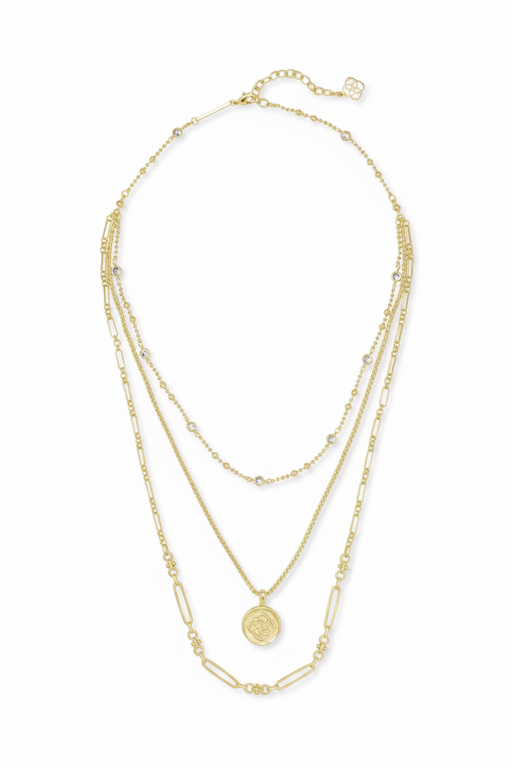 Three-layer 14k gold-plated Kendra Scott necklace with small bead accents, geometric links, round medallion pendant, and adjustable clasp. Available in 16", 18", and 20" lengths.
