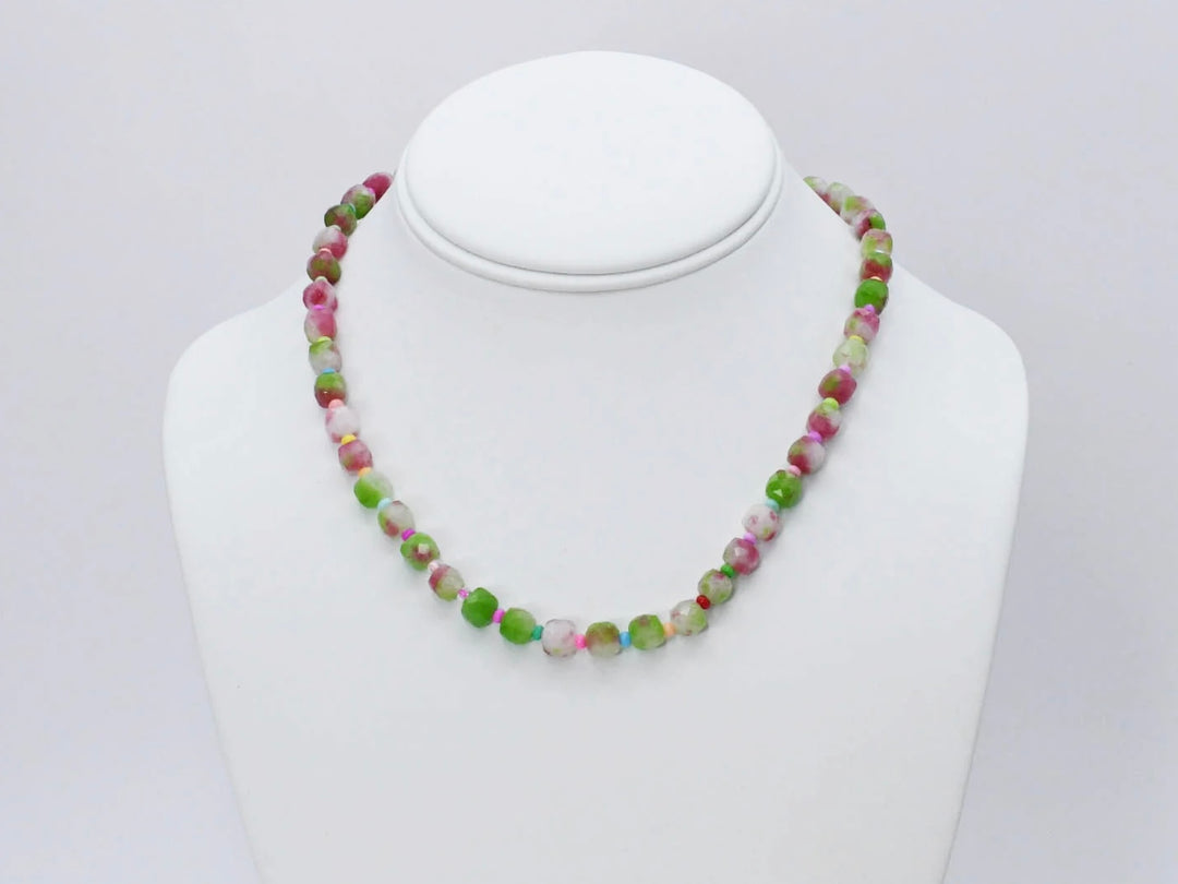 The Camo Girly Necklace by Treasure Jewels has round, faceted beads in green, pink, white, and beige. Sizes available.
